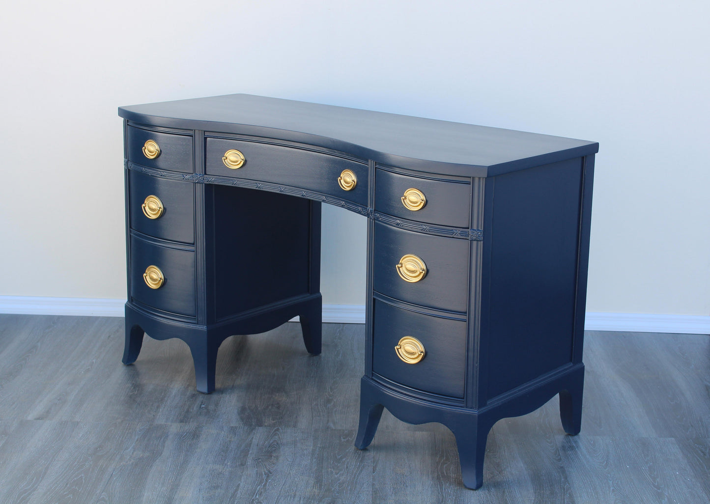 Vintage mahogany desk of five drawers.  This desk is solid built with dovetail joints.  This desk is newly refinished in blue with gloss topcoat and gold painted hardware.  Dimensions: 49.5"Width x 20"Depth x 30"Height. 