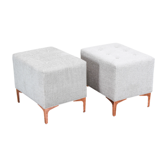 Elegant pair of custom design ottomans upholstered in a soft cream chenille fabric  and supported by elegant Italian style feet with rose gold finish.  Dimensions; 22"Width x 16"Depth x 18"Height.