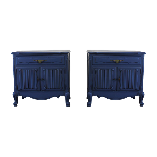 Vintage pair of French Style Nightstands.  These nightstands are solid built with a dovetail drawer and double doors that open to a storage space.  These nightstands are professionally refinished in blue with antique glaze and brass hardware.  Dimensions; 27" Width x 17" Depth x 27" Height. 