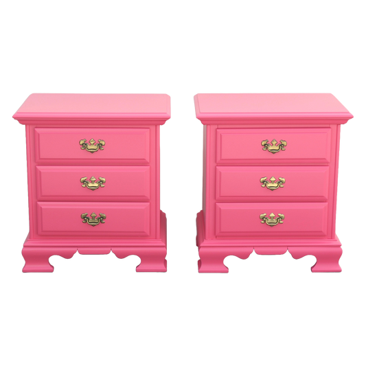 Solid Built Pair of 1970's Nightstands by Dixie. The nightstands are professionally refinished in coral pink with a satin topcoat. Dimensions: 24"Width x 17"Depth x 26"Height. 
