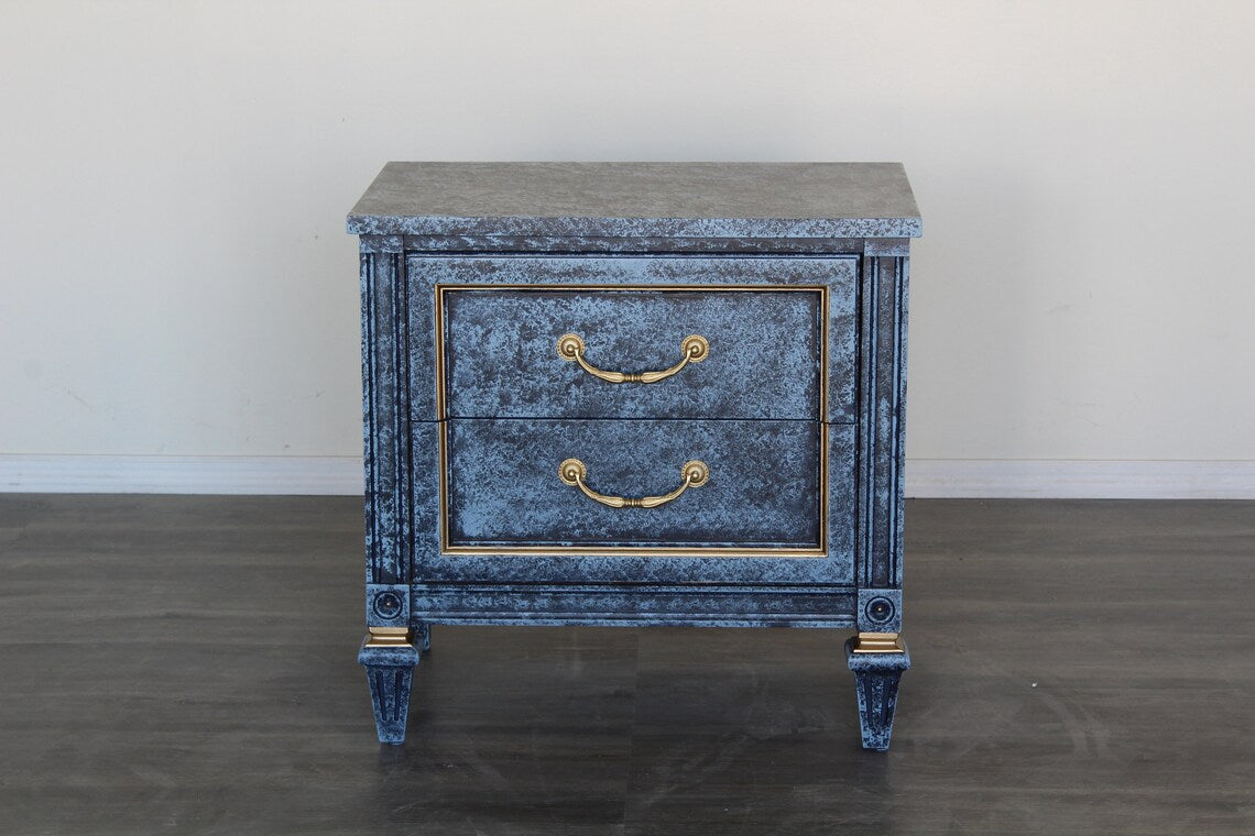 Pair of Mid century solid built walnut nightstands.  The nightstands are professionally refinished with a blue faux finish.  Dimensions: 25"width x 16"Depth x 25"Height. 