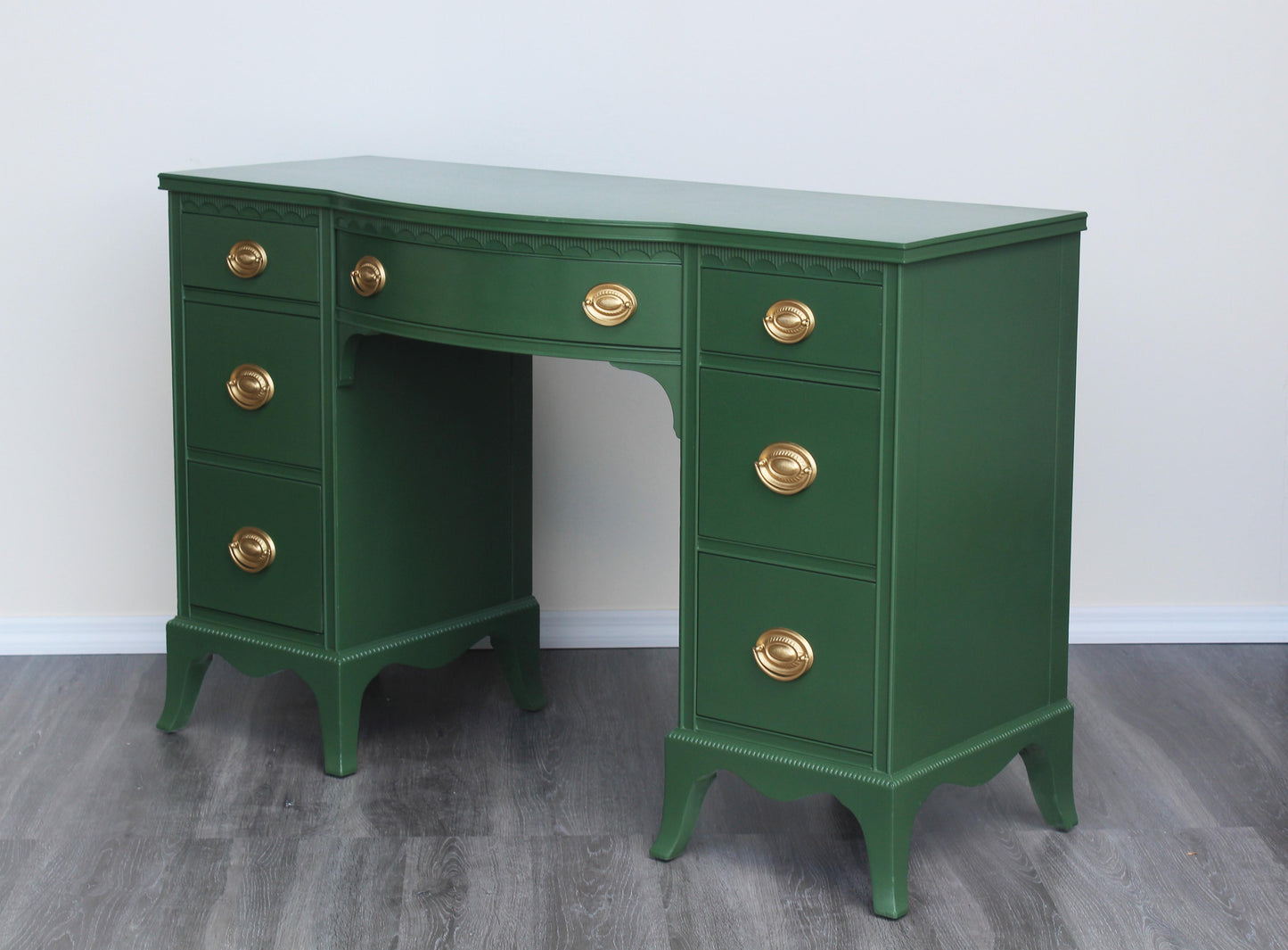 Vintage solid built double pedestal desk with dovetail joint.  This desk was professionally refinished in green with gloss finish and gold painted hardware.  Dimensions: 47"Width x 16.5"Depth x 31"Height. 
