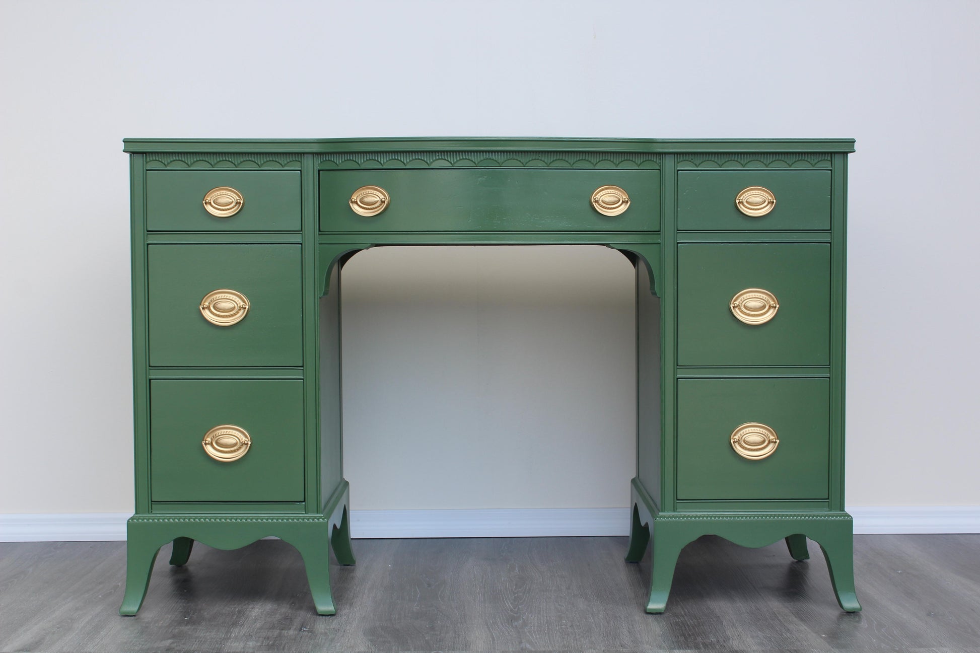 Vintage solid built double pedestal desk with dovetail joint.  This desk was professionally refinished in green with gloss finish and gold painted hardware.  Dimensions: 47"Width x 16.5"Depth x 31"Height. 