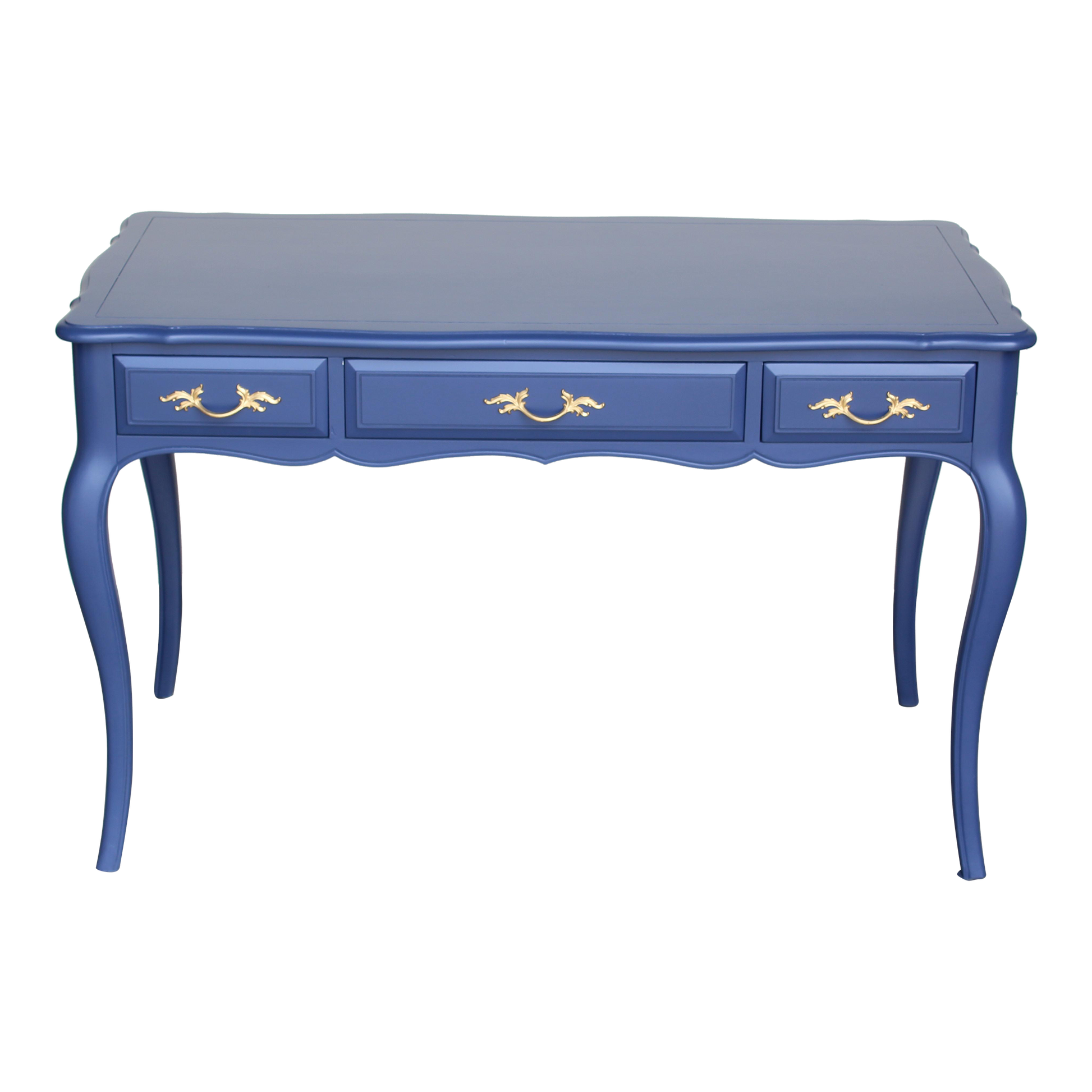 Vintage French Provincial desk of three drawers.  This desk is solid built with dovetail joints is professionally refinish in blue with satin top coat, and gold painted hardware.  Dimensions: 48"Width x 25"Depth x 30"Height.