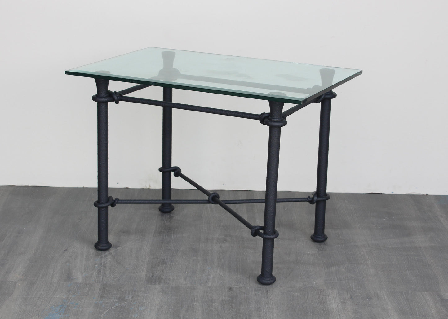 Vintage Giacometti style Iron side table with glass top.  Dimensions:30"Width x 20"Depth x 22"Height. 