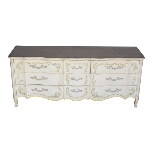 Vintage cream John Widdicomb cream dresser of nine drawers.  This dresser is solid built with dovetail joints, with a dark stained walnut top.  Dimensions: 76"Length x 21"Depth x 32"Height. 