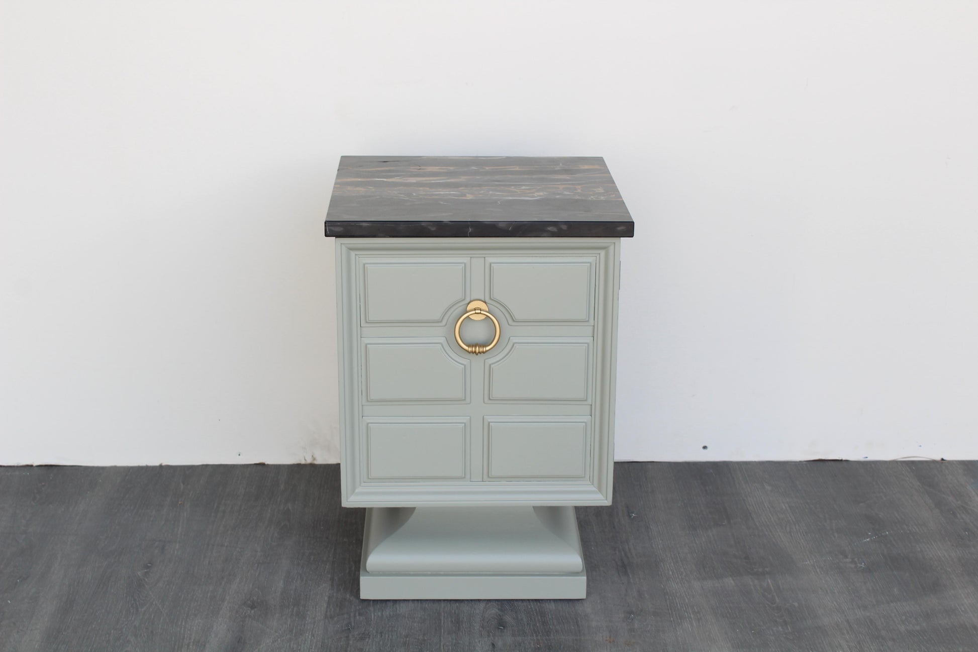 Vintage Art Deco side table with black marble top.  This table was refinished in green with satin top coat.  Dimensions: 15"Width x 15"Depth x 22"Height. 