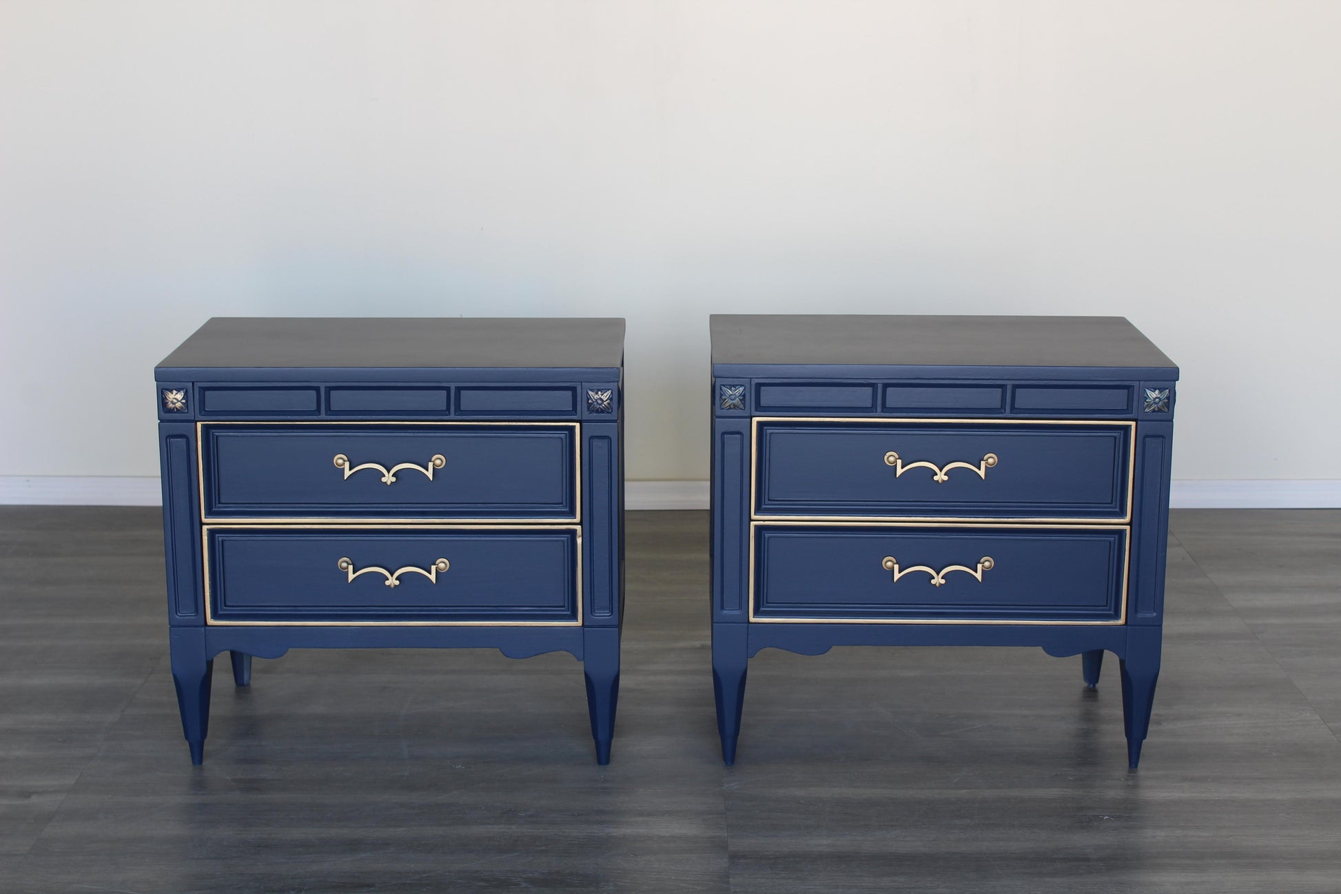 Mid Century Walnut nightstands.  The nightstands are solid built with dovetail joints, and are professionally refinished in blue  with a satin finish and gold painted accents.  Dimensions; 25"Width x 16"Depth x 23" Height. 