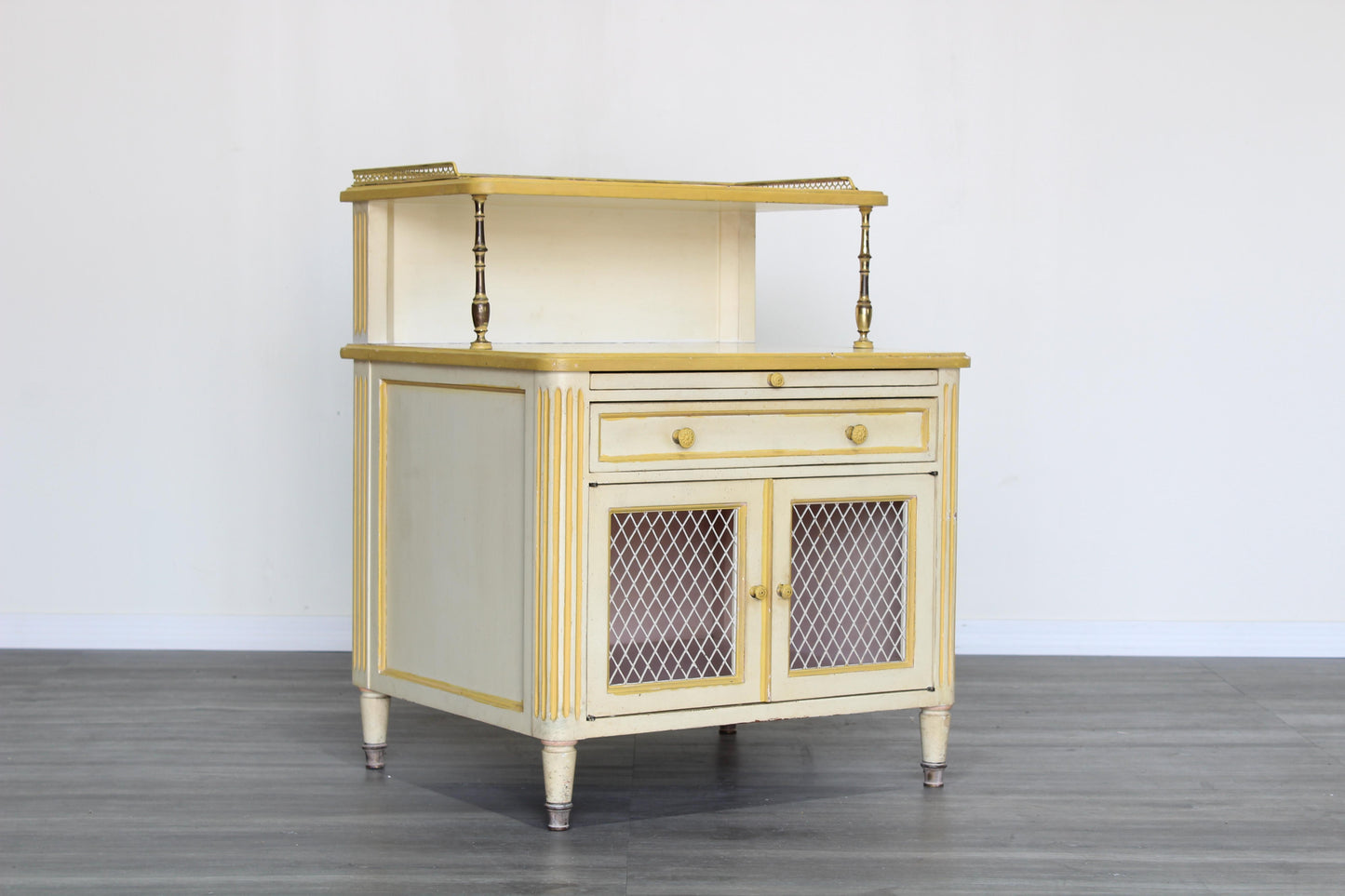 Pair of Late 20th century nightstands.  The nightstands are solid built with dovetail joints and brass accents, and a tray top, a pull out tray and a single drawer with storage space.  Dimensions; 24" Width x 21' Depth x 31" Height x 22" Height to middle top.