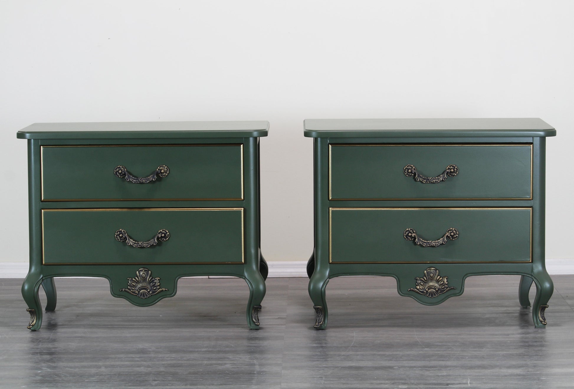 Pair of Mid century walnut nightstands.  The nightstands are professionally refinished in green with a satin finish and gold painted accents.  Dimensions: 30"Width x 18"Depth x 24"Height