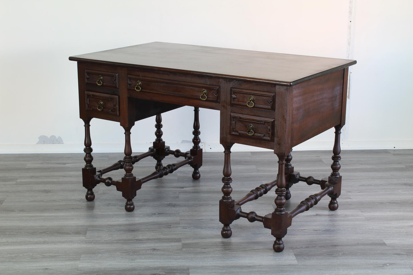 Mid century Mahogany desk of five drawers.  This desk is solid mahogany.  Dimensions; 48" Width x 28" Depth x 30" Height.