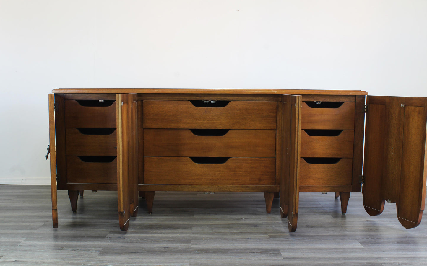 Mid Century Walnut Dresser of Nine Drawers