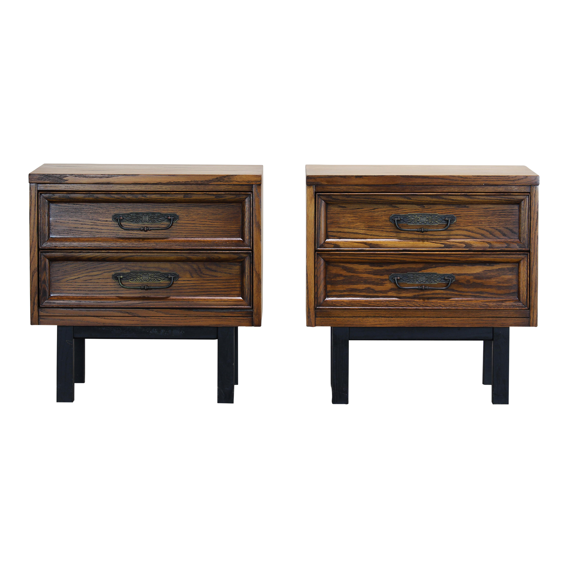 Pair of Mid century walnut nightstands.  The nightstands are solid built with dovetail joints and metal hardware.  Dimensions: 24"Width x 16"Depth x 24"Height. 