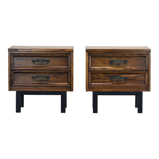 Pair of Mid century walnut nightstands.  The nightstands are solid built with dovetail joints and metal hardware.  Dimensions: 24"Width x 16"Depth x 24"Height. 