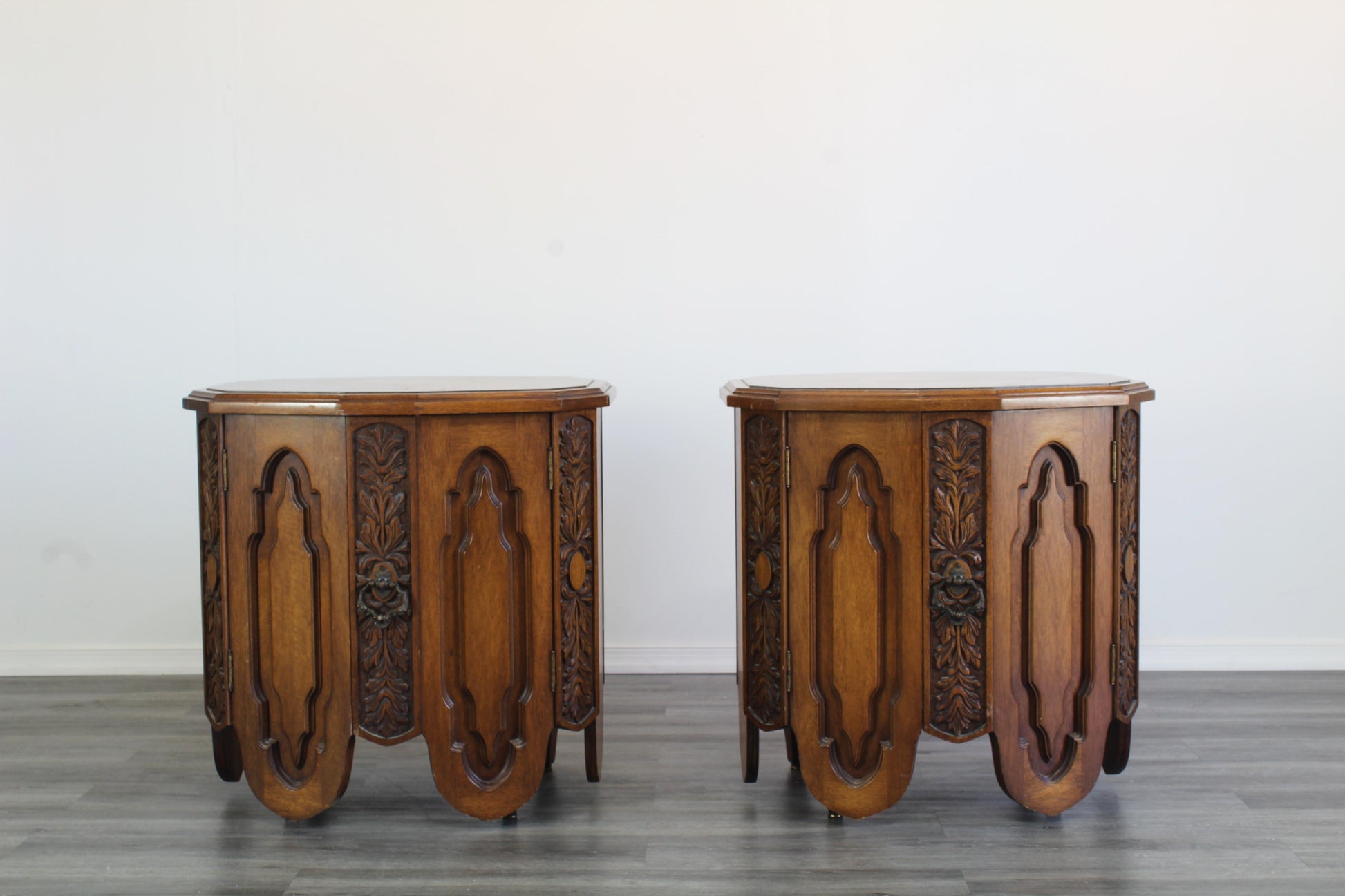 Pair of Mid century walnut nightstands.  These is a solid built pair of walnut nightstand with double double doors and single drawers. Marked "Freed-Warran Inc NY".  Dimensions; 26" Width x 20" Depth x 26" Height. 