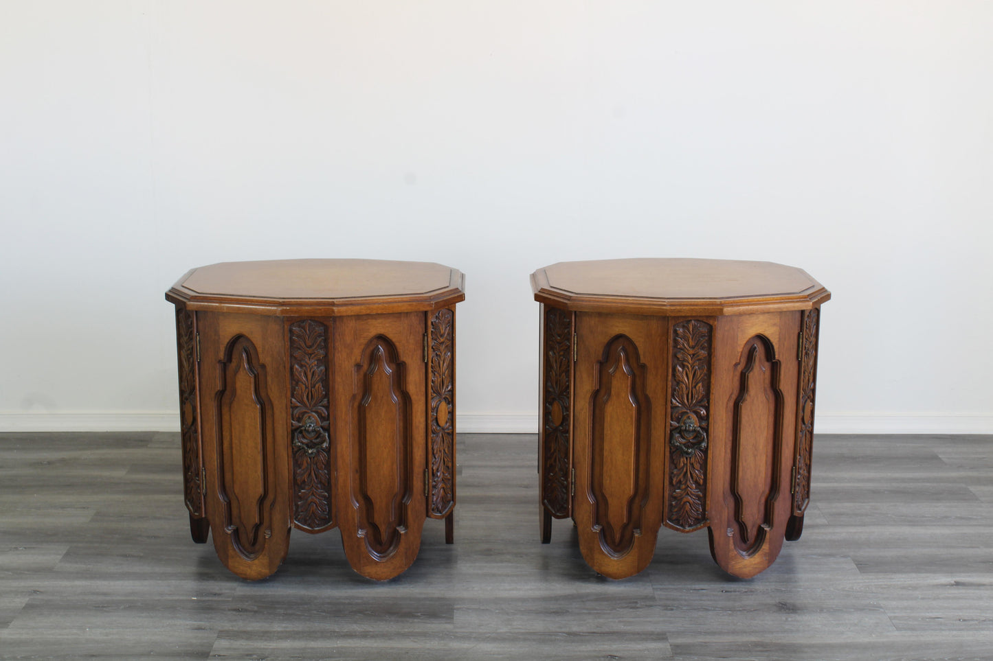 Pair of Mid century walnut nightstands.  These is a solid built pair of walnut nightstand with double double doors and single drawers. Marked "Freed-Warran Inc NY".  Dimensions; 26" Width x 20" Depth x 26" Height. 