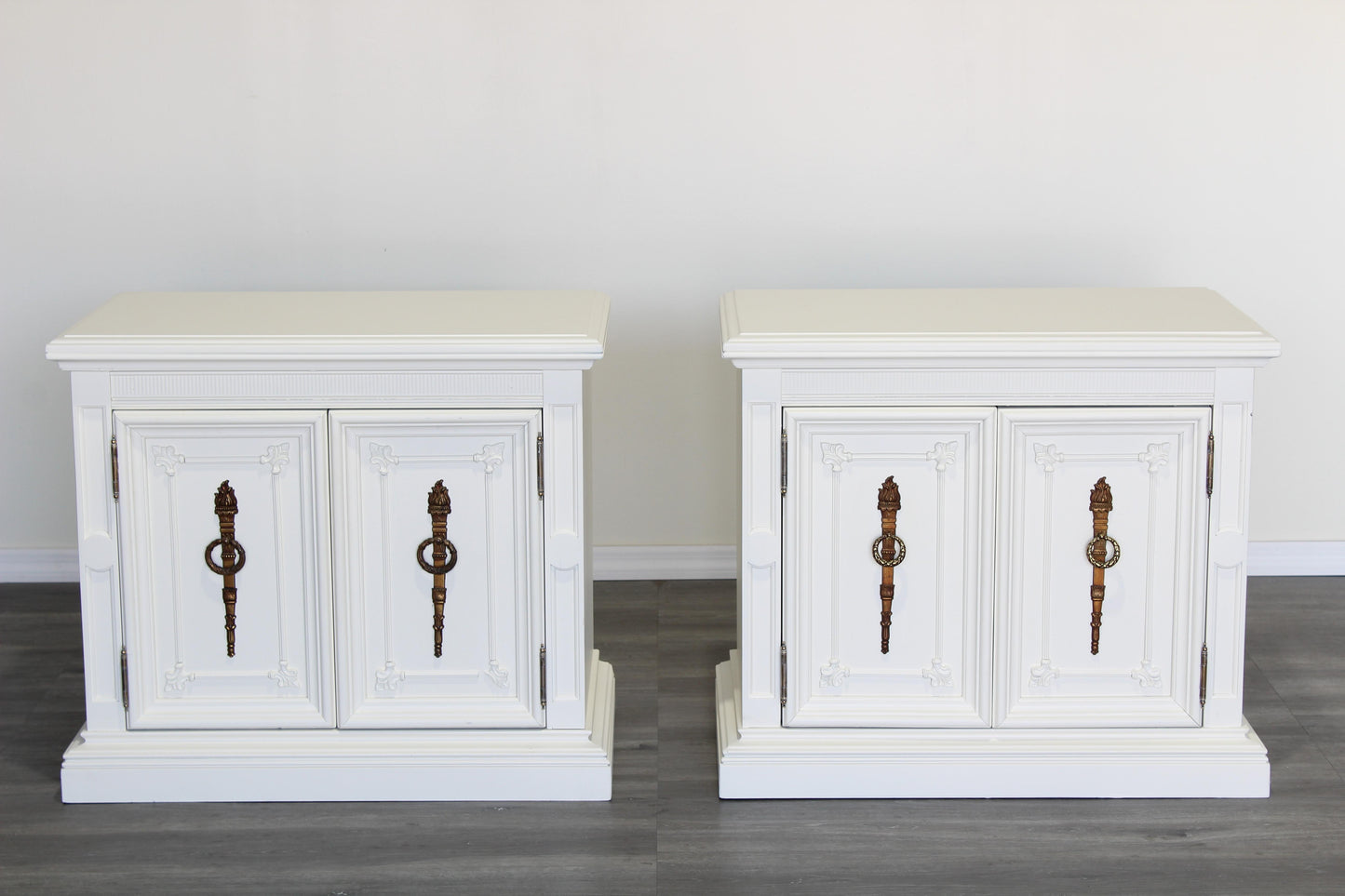 Pair of Mid century cream double door nightstands.  The nightstands are solid built and professionally refinished in off white with satin finish.  Dimensions; 28" Width x 16" Depth x 25" Height. 