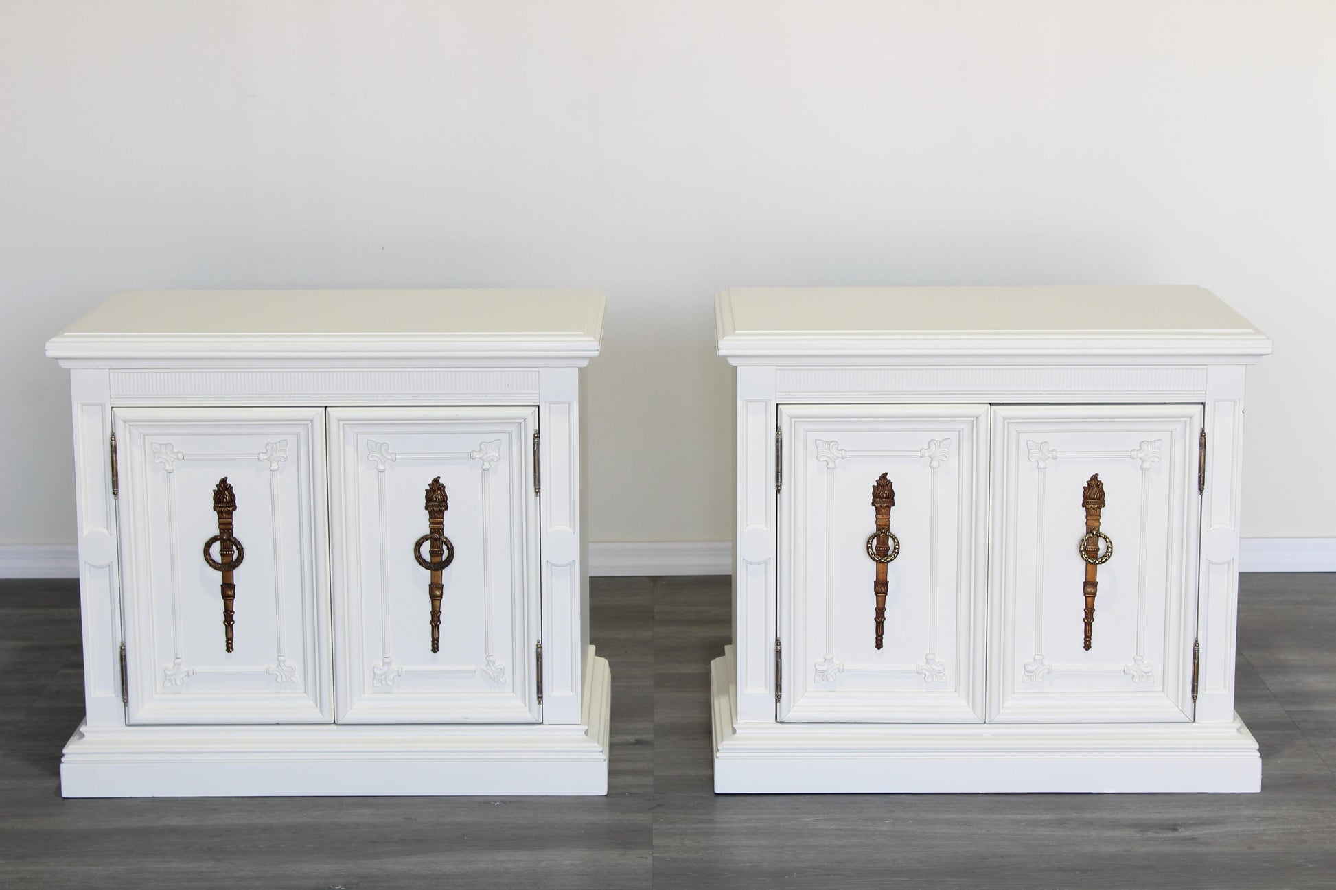 Pair of Mid century cream double door nightstands.  The nightstands are solid built and professionally refinished in off white with satin finish.  Dimensions; 28" Width x 16" Depth x 25" Height. 