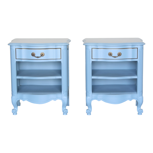 Vintage solid built pair of nightstands.  The nightstands are professionally refinished in a lovely pastel blue with a satin finish.  Dimensions: 23"Width x 16"Depth x 27"Height. 