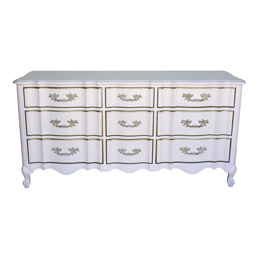 Vintage French provincial solid built dresser of nine drawers.  This dresser was professionally refinished in a Champagne pink and gold with satin top coat.  Dimensions: 64"Width x 20"Depth x 32"Height. 