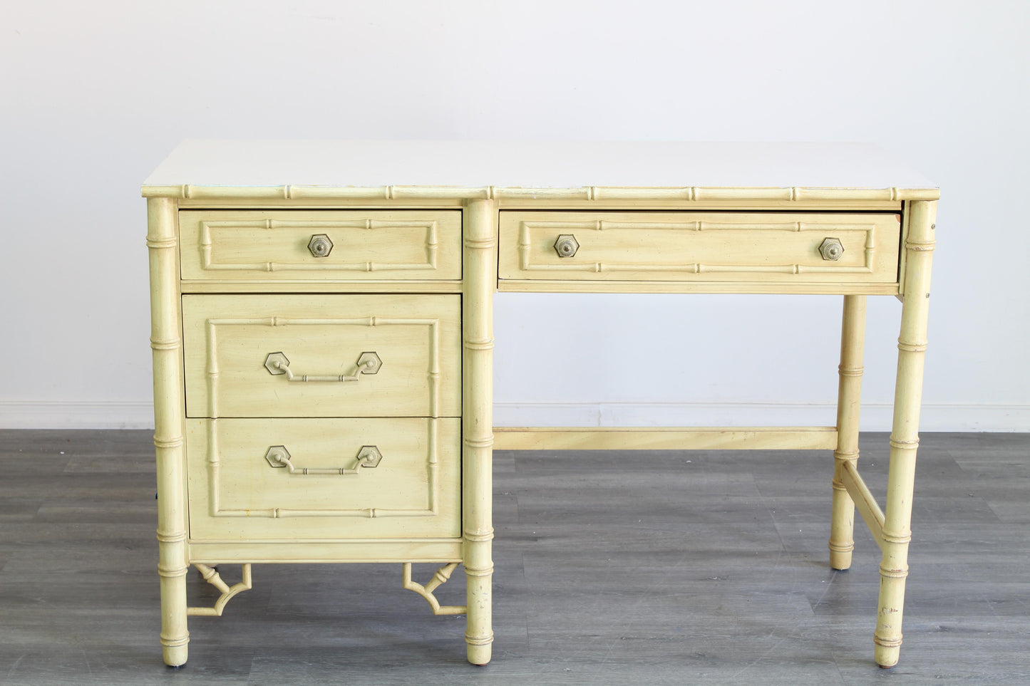 Vintage Faux Bamboo Desk of four drawers with Formica Top.  Dimensions; 46" Width x 19" Depth x 30" Height. 