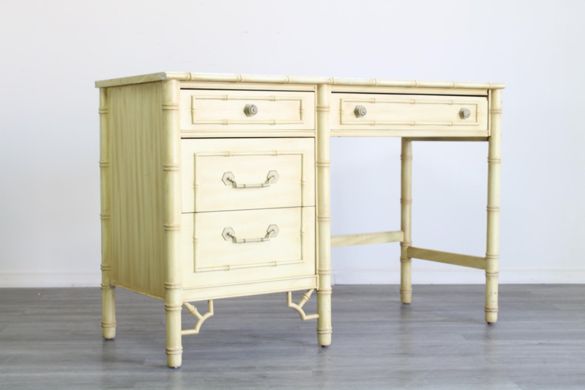 Vintage Faux Bamboo Desk of four drawers with Formica Top.  Dimensions; 46" Width x 19" Depth x 30" Height. 