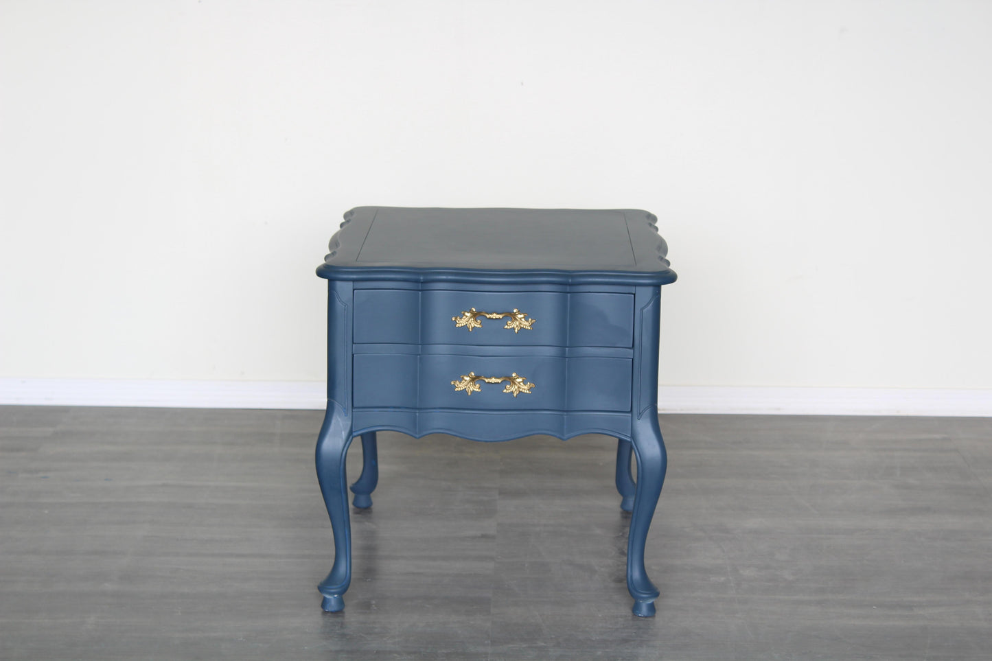 Vintage French provincial blue nightstand.  This nightstand is professionally refinished in blue with gold painted hardware.  Dimensions: 22" Width x 26"Depth x 22"Height. 