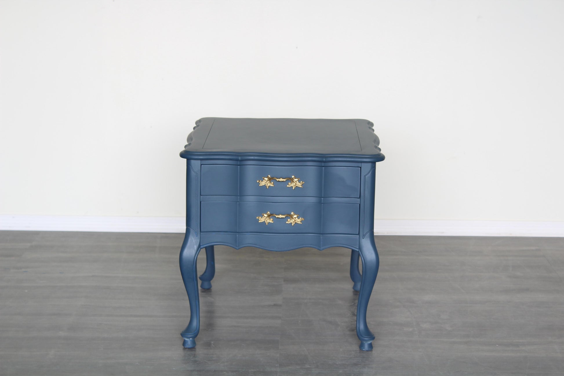 Vintage French provincial blue nightstand.  This nightstand is professionally refinished in blue with gold painted hardware.  Dimensions: 22" Width x 26"Depth x 22"Height. 