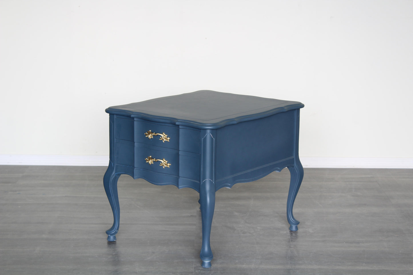 Vintage French provincial blue nightstand.  This nightstand is professionally refinished in blue with gold painted hardware.  Dimensions: 22" Width x 26"Depth x 22"Height. 