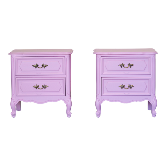 Pair of solid built French style nightstands of two drawers.  The nightstands are professionally refinished in a cotton candy pink with a satin finish.  Dimensions; 24" Width x 16" Depth x 25" Height. 