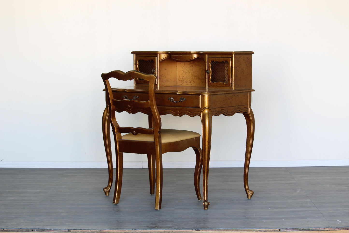 Vintage French style writing desk of two drawers.  Dimensions; 34" Width x 20" Depth x 40" Overall Height x 29" Height to Desk Surface. 