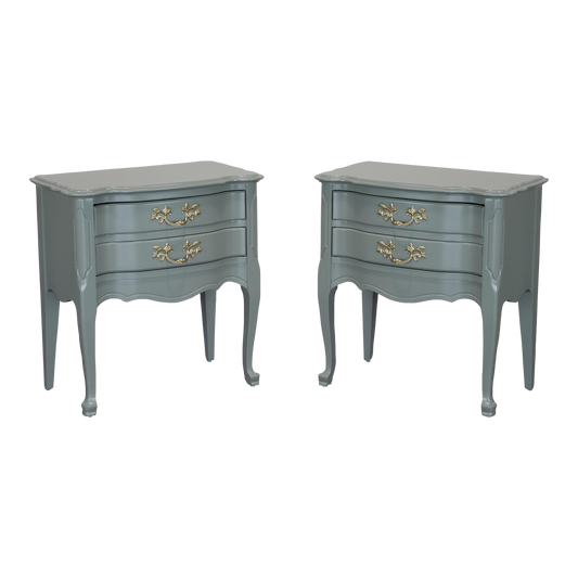 Vintage pair of French style nightstands of two drawers.  These nightstands are professionally refinished in green with satin top coat.  Dimensions: 24"Width x 14"Depth x 25"Height. 