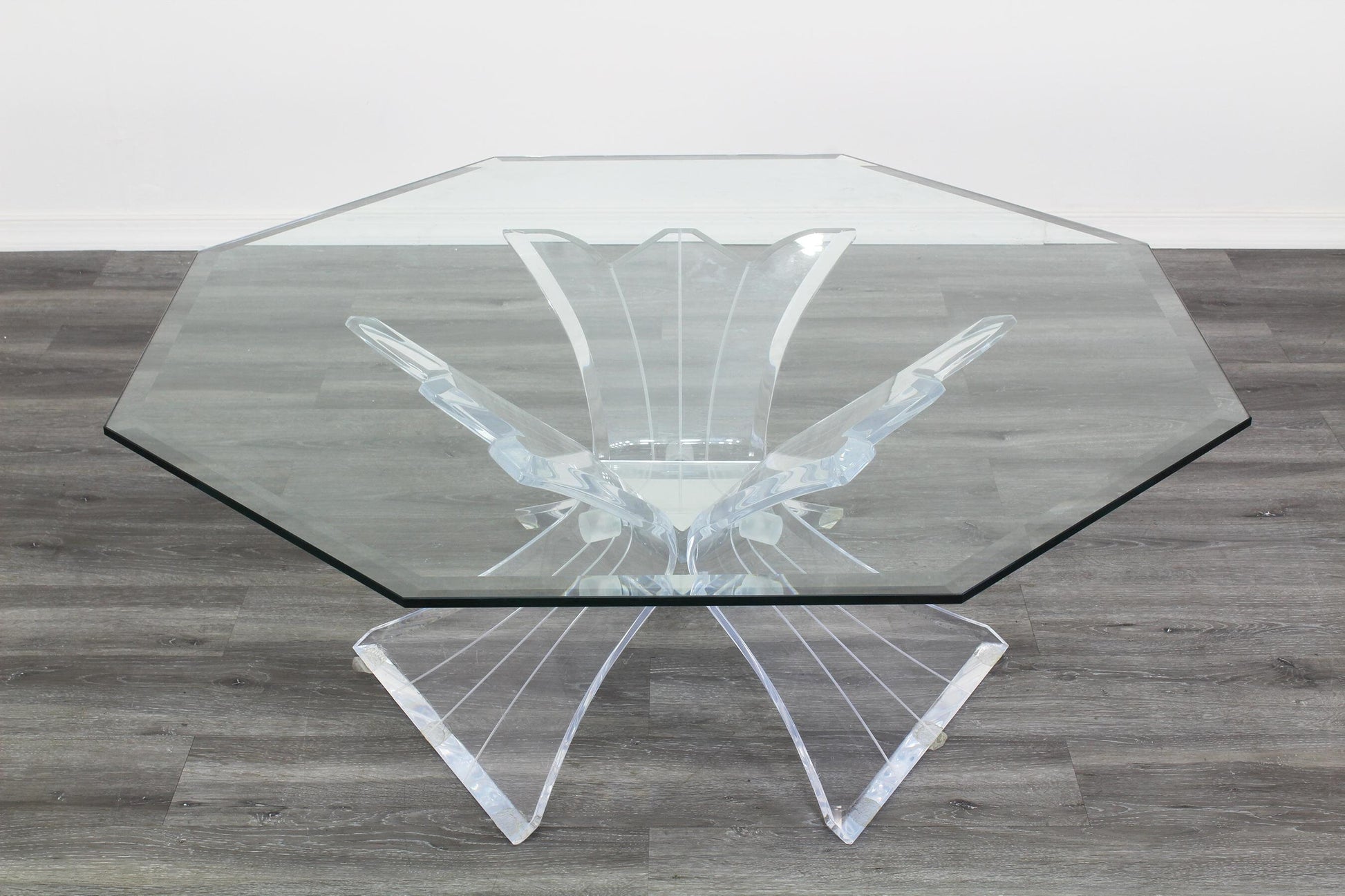 Vintage Lucite butterfly coffee table with Octagonal glass top.  This lovely table is in great vintage condition. Dimension; 42 in. Width x 42 in. Depth x 16 in. Height. 