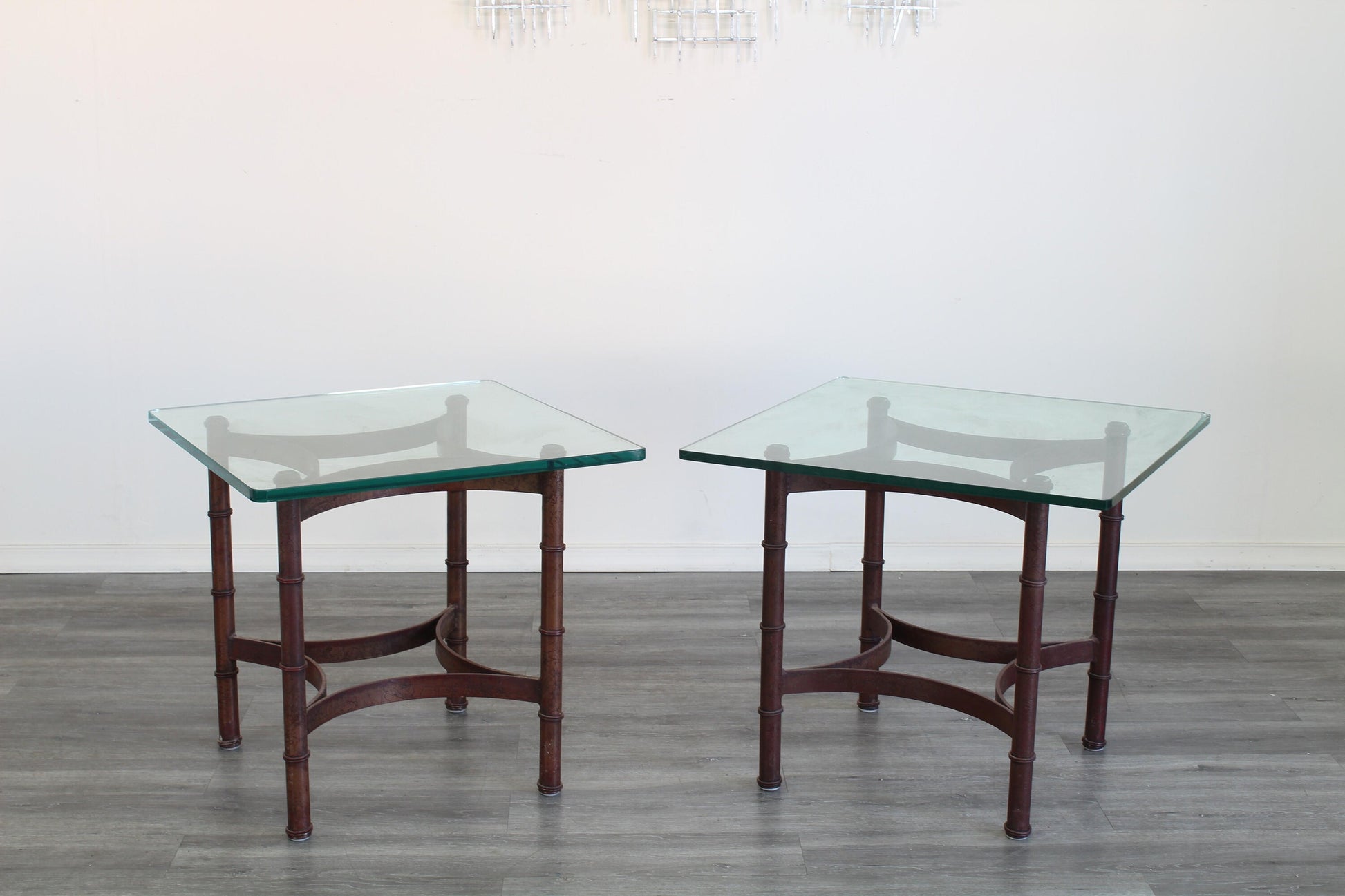 Pair of vintage faux bamboo iron side table with glass top.  This table are gold painted with black splatters.  Dimensions; 24" Width x 24" Depth x 22" Height. 