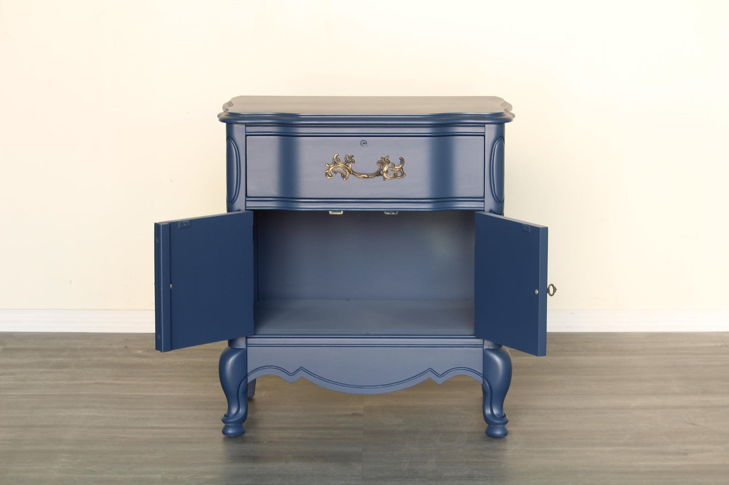 Vintage French provincial scalloped nightstand.  This nightstand is solid built with dovetail joint and metal hardware.  This nightstand is newly painted in blue with satin top coat.  Dimensions; 25" Width x 17"Depth x 27" Height. 