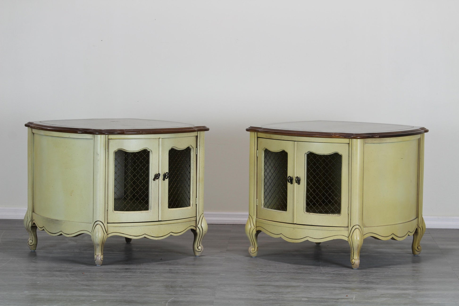 Vintage Mid century yellow round side tables with walnut top.  These side tables have double door with storage space.  Dimensions: 26"Width x 26"Depth x 21"Height. 