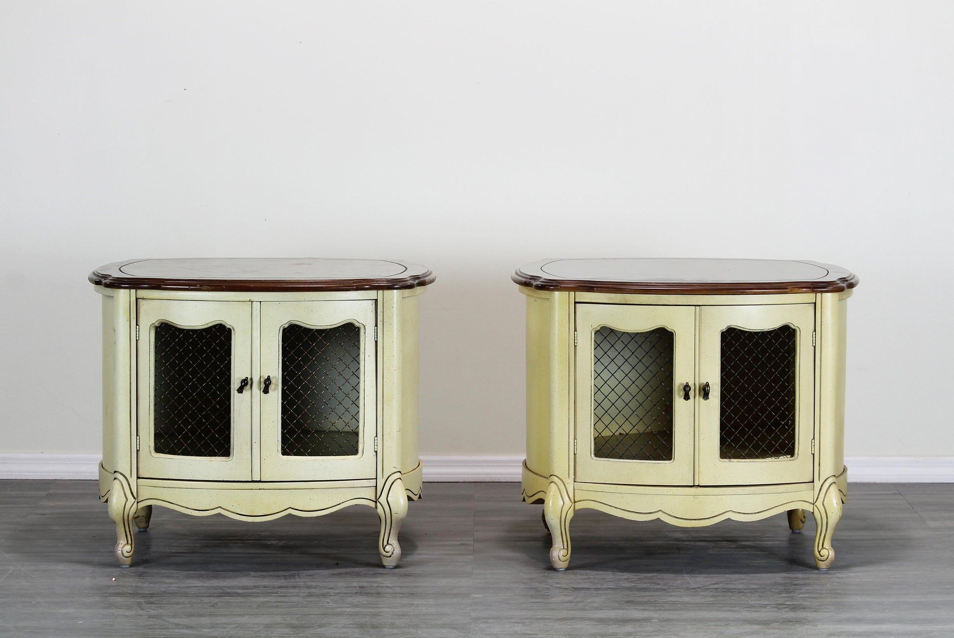 Vintage Mid century yellow round side tables with walnut top.  These side tables have double door with storage space.  Dimensions: 26"Width x 26"Depth x 21"Height. 