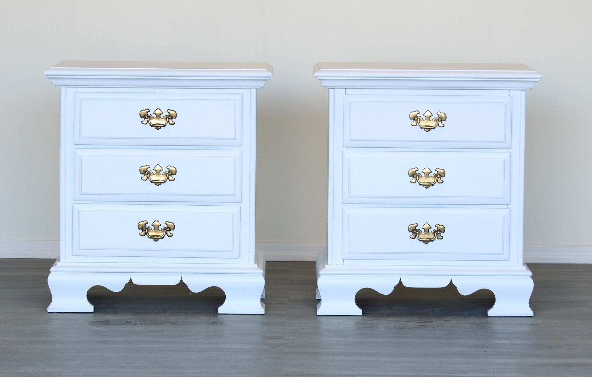 Vintage pair of solid built Georgian style nightstands.  These nightstands are newly painted in white with metal hardware.  Dimensions: 24"Width x 18"Depth x 26"Height. 