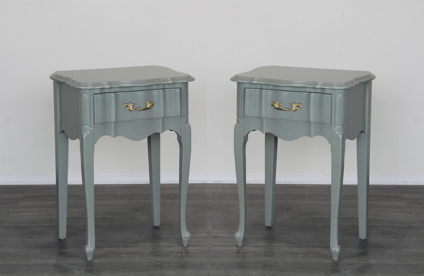 Vintage pair of green nightstand of single drawer.  These nightstands are professionally refinished in caledon green with a satin top coat.  Dimensions: 20"Width x 16"Depth x 28"Height.