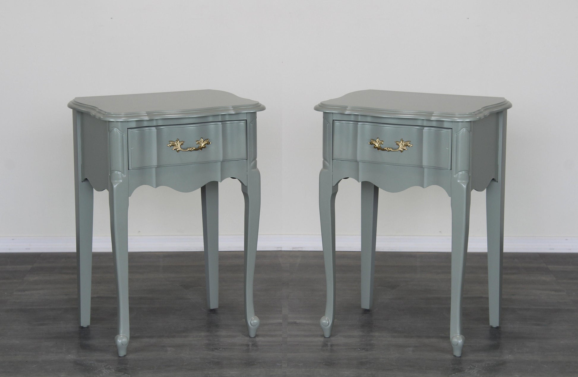 Vintage pair of green nightstand of single drawer.  These nightstands are professionally refinished in caledon green with a satin top coat.  Dimensions: 20"Width x 16"Depth x 28"Height.