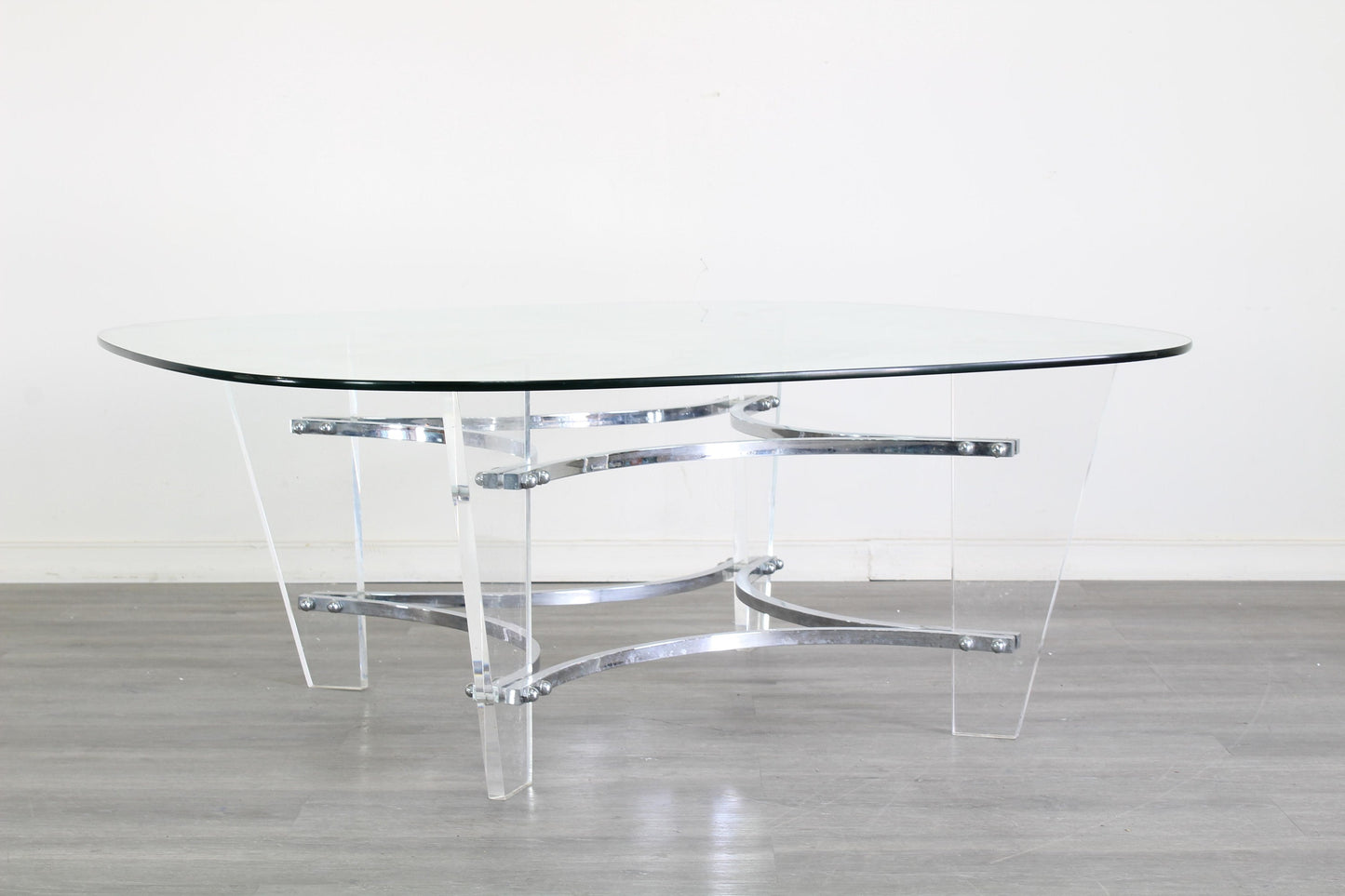 Vintage Lucite and chrome coffee table with glass top.  This table is in great vintage condition.  Dimensions; 42" Width x 42" Height x 17" Height. 